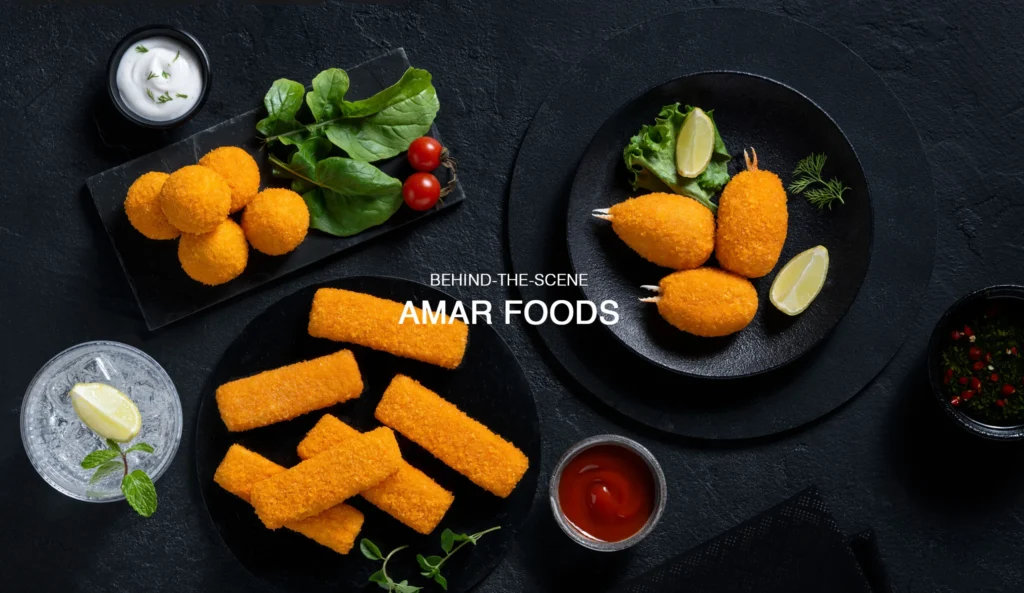 Behind-the-scenes food styling for Amar Foods, featuring crisp golden snacks with garnishes and dips on black plates.